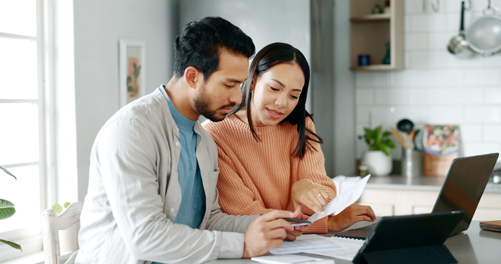 couple looking at home insurance coverage paperwork