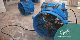 Two blue industrial plans are on a concrete floor. 