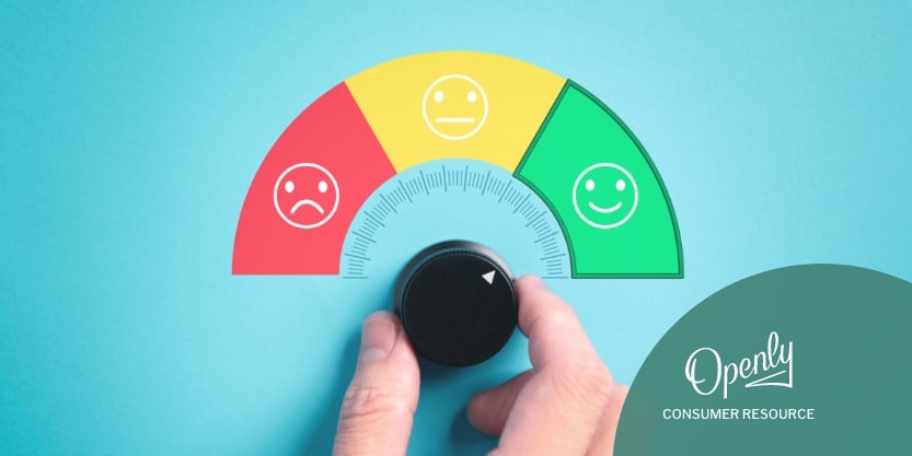 A person moves a dial under a half circle with a red unhappy smiley face, a yellow passive smiley face, and a green happy smiley face. 