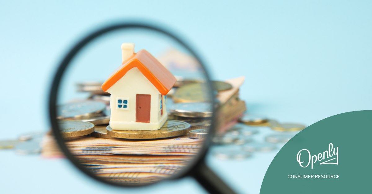 A graphic of a toy house sitting on a pile of cash, as seen through a magnifying glass.